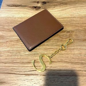Coach Brown leather passport cover and Dooney & Bourke hangtag “S”